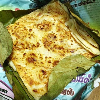 TREASURE PARATHA IN BANANA LEAF (KIZHI PORRATA)